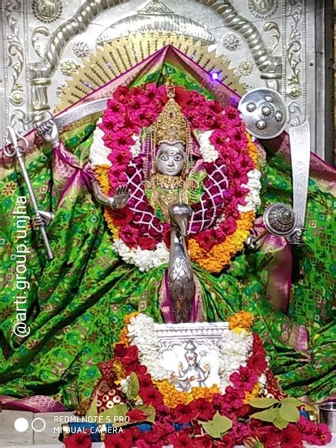 the statue is decorated with flowers and decorations