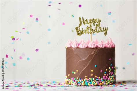 Chocolate birthday cake with happy birthday banner Stock Photo | Adobe Stock