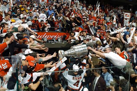 New Jersey Devils captain Scott Stevens carries the Stanley Cup off the ...