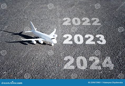 Toy Aircraft and Calendar Years Painted on Runway Stock Image - Image ...