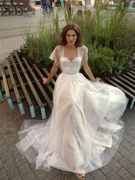 A-line wedding gown with butterfly sleeves and embroidered sweetheart bodice