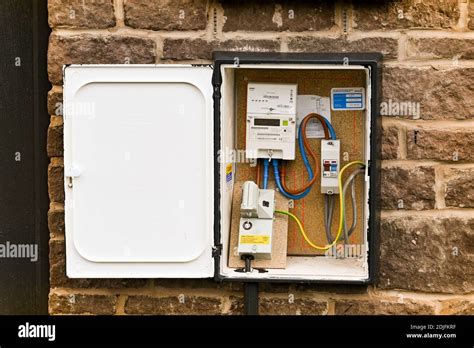 Cardiff, Wales - December 2020: Electricity meter box with cover open ...