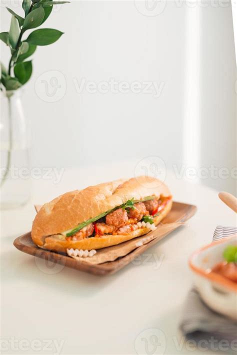 Banh Mi Xiu Mai - Vietnamese sandwich with meatballs in tomato sauce ...