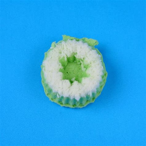 Premium Photo | Putri ayu cake isolated on a blue background, a traditional indonesian cake that ...