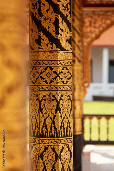 Small temple or chapel, with plant motifs drawn on its columns next to Phra tamnak Daeng, in ...