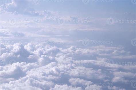 Beautiful cloudy sky from aerial view background. Airplane view above clouds. Sky and cloud ...