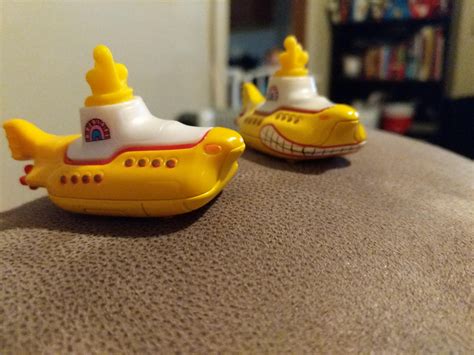 So, we have 2 yellow submarine hot wheels with different paint. The one with the mouth is die ...