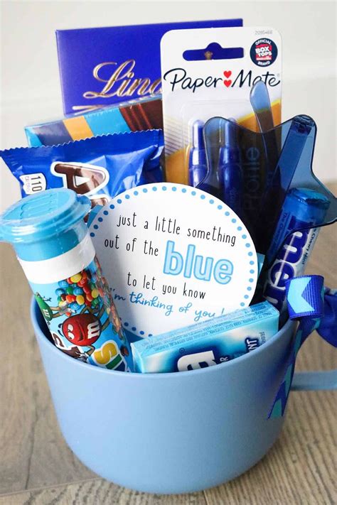 a blue bucket filled with lots of different items