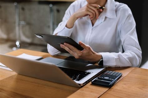 Premium Photo | Business people working in the work area with laptop and tablet at the desk