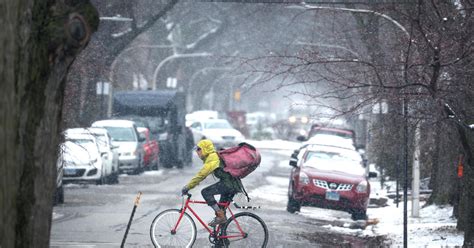 Storm system dumps heavy snow on Indiana and Michigan after bringing ...