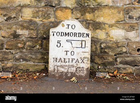 An traditional stone milestone marker in Haden Bridge, West Yorkshire, UK Stock Photo - Alamy