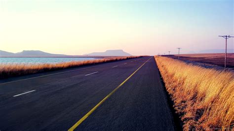 empty-road-at-sunset-by-the-water | al-Mubarok