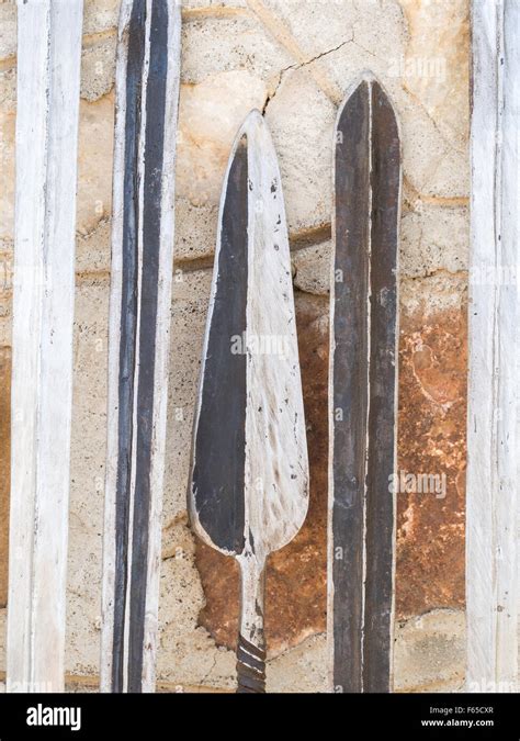 Maasai weapons: swords, spears and knifes, sold as souvenirs at a local ...