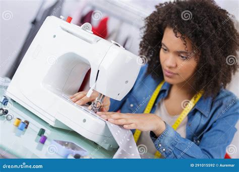 Young Female Dressmaker Using Sewing Machine Stock Photo - Image of ...