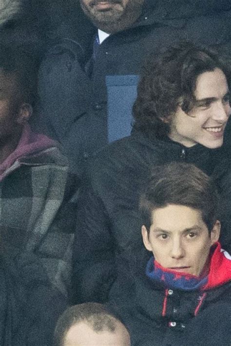 FLORENCE PUGH and Timothee Chalamet at PSG Match at Parc Des Princes in ...