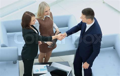 Business people shaking hands during a meeting | Stock image | Colourbox