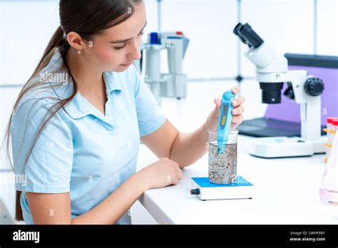 Scientist analysing liquid sample Stock Photo - Alamy