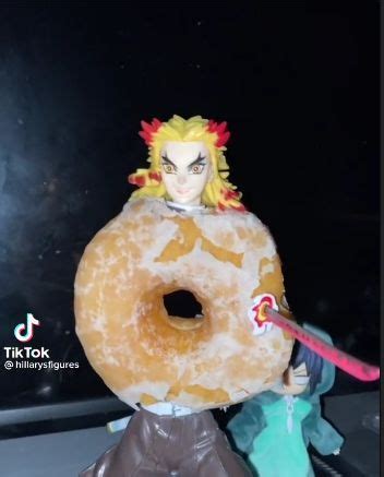 an action figure is holding a giant donut