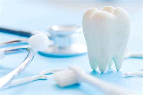 Dental model and dental equipment on blue background, concept image of dental background. dental ...