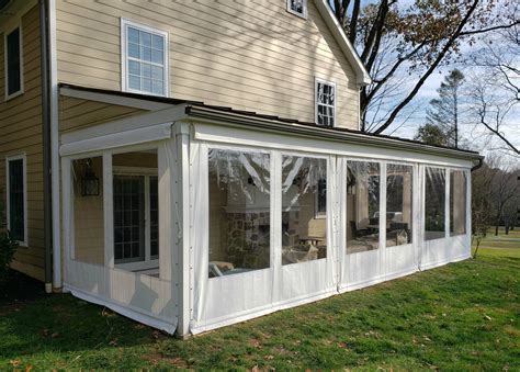 Clear Vinyl Drop Curtains - on a farmhouse porch | Kreider's Canvas Service, Inc.