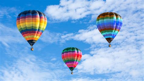 Colorful hot air balloons on the blue sky - Wonders & Holidays