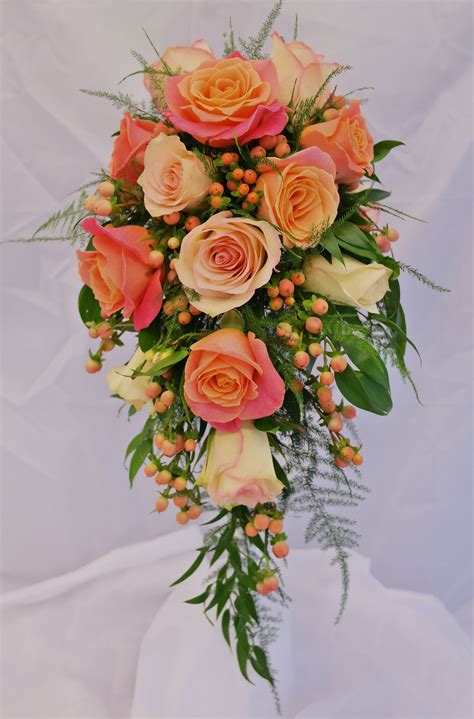 Bridal shower bouquet in Miss Piggy and Kiwi roses and pink Hypericum. | Bridal shower bouquet ...
