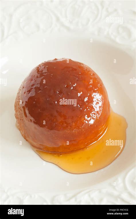 Steamed golden syrup sponge pudding Stock Photo - Alamy