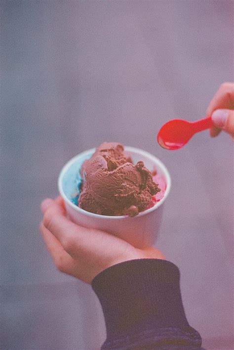 Person Holding Ice Cream With Red Spoon · Free Stock Photo