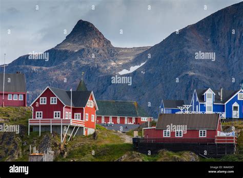 Greenland, Sisimiut. Nasaasaaq mountain towering above colorful ...