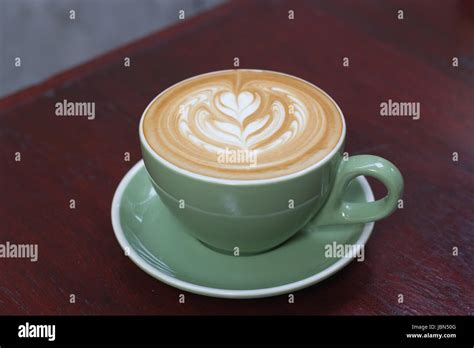 Hot Coffee latte with beautiful latte art Stock Photo - Alamy