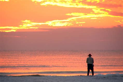 Sunsets | Free Stock Photo | A person watching the sunset on the beach | # 9954