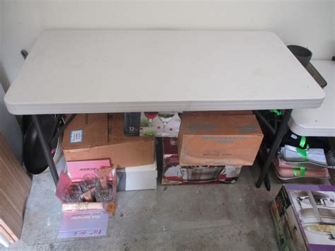 4 Foot Folding Table | EstateSales.org