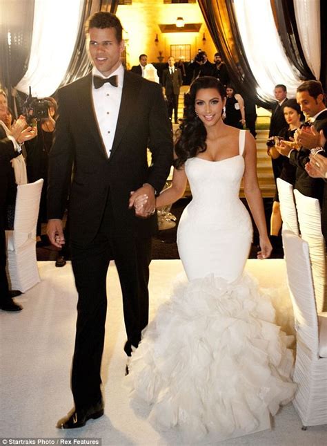 Costume change: Newlywed Kim Kardashian dons dress number two as she ...