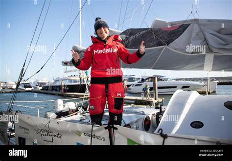 Pip Hare celebrates after arriving into Poole Quay on her boat Medallia, after completing the ...