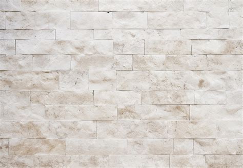 Premium AI Image | a wall of beige tiles with a textured background.