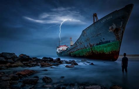 Download Stranded Person From Broken Ship Wallpaper | Wallpapers.com