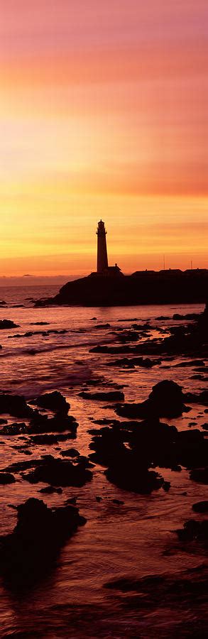 Silhouette Of A Lighthouse At Sunset Photograph by Panoramic Images | Fine Art America