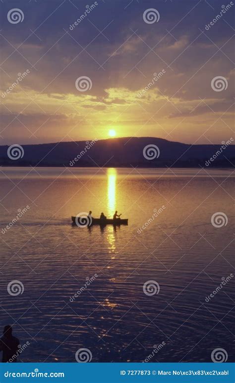 Boat on lake at sunset stock image. Image of orange, landscapes - 7277873