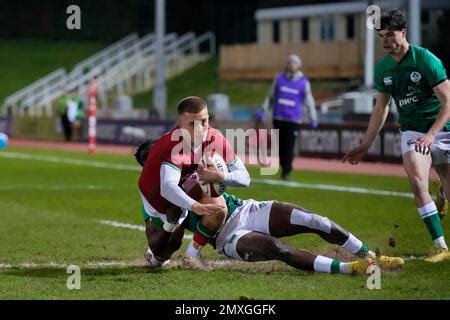 Ike Anagu #14 of Ireland U20's tackless Cameron Winnett #15 of Wales ...