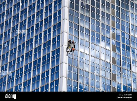 Window cleaner cleaning windows of glass skyscraper Stock Photo, Royalty Free Image: 99317241 ...