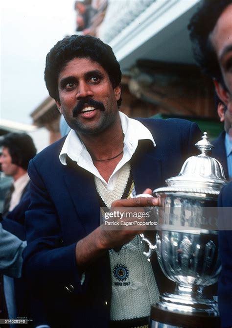 India captain Kapil Dev holds the trophy after the World Cup Final...