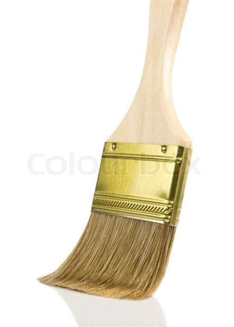 Wooden gold paintbrush isolated on ... | Stock Photo | Colourbox