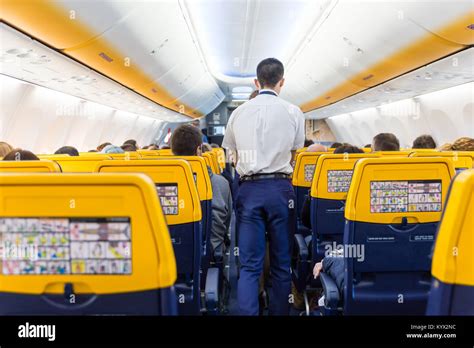 Interior of commercial airplane during flight Stock Photo - Alamy