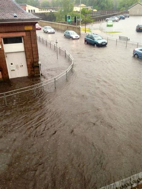 In pictures: Flash flooding slows Greenock traffic - BBC News