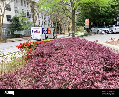Atlanta, GA/USA-3/21/20: A Fedex truck delivering package to Condominiums and Corporate ...