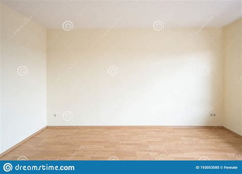 Empty Room in an Apartment with Light Walls and Wood Decor Laminate on ...