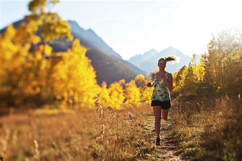 A Young Woman Trail Running In The Fall Photograph by Patrick Orton - Fine Art America