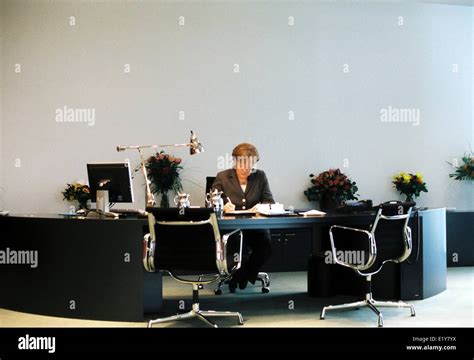 Chancellor Angela Merkel (CDU) sits at her desk in the Federal Stock ...