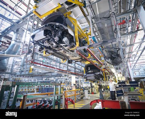 Workers on car production line in car factory Stock Photo - Alamy