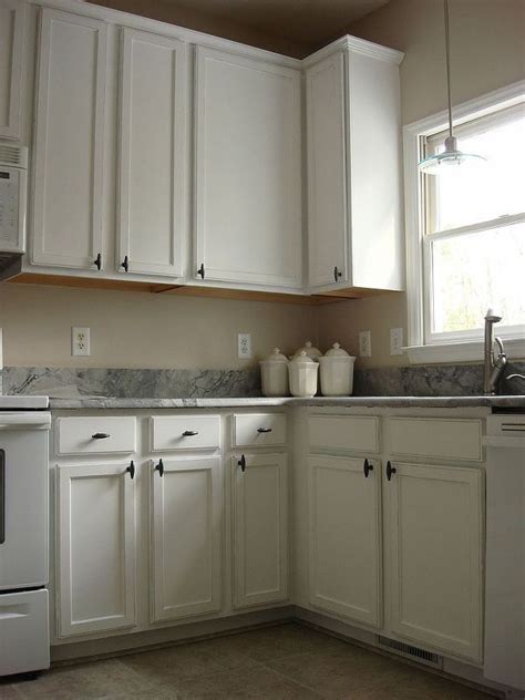 Old Oak Cabinets Painted White and Distressed | Kitchen renovation, Oak cabinets, Kitchen cabinets